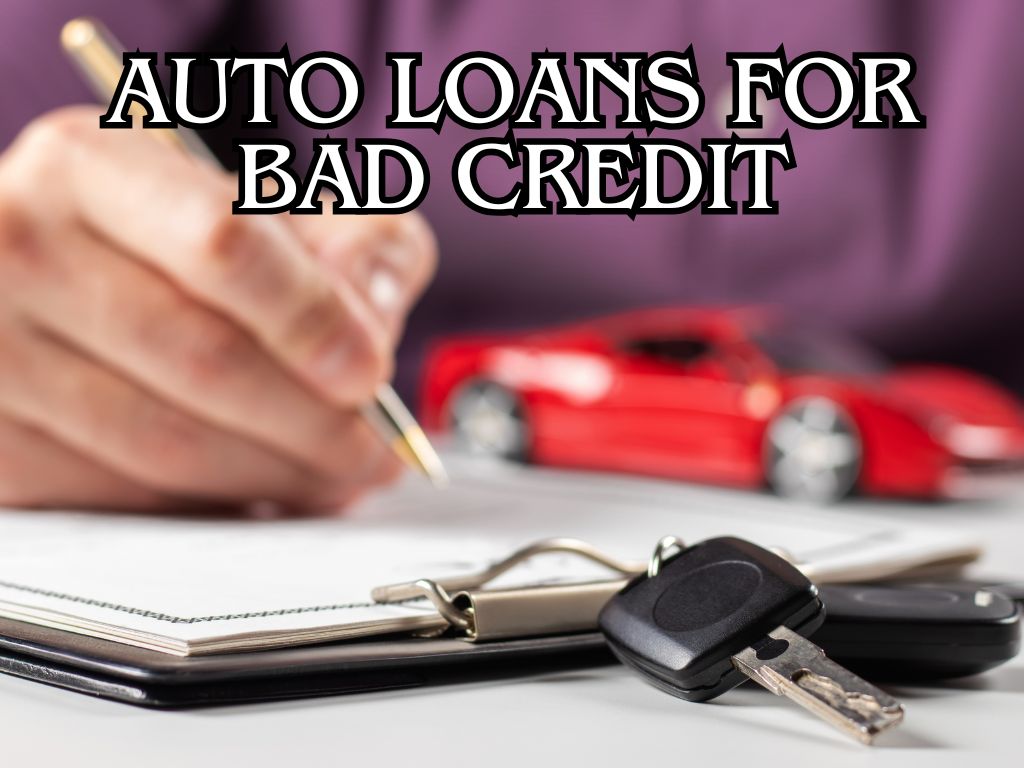 Close-up of a person signing an auto loan contract with car keys on a document and a red car in the background.