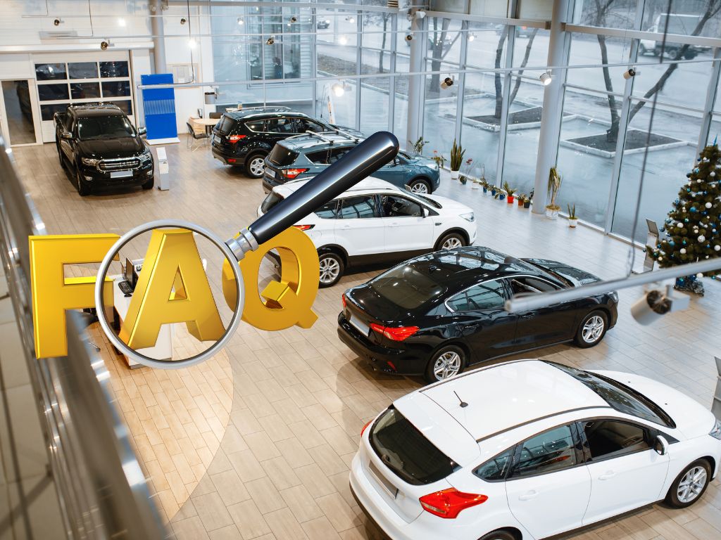 Car dealership showroom with a magnifying glass over the bold letters "FAQ," highlighting frequently asked questions about auto loans.