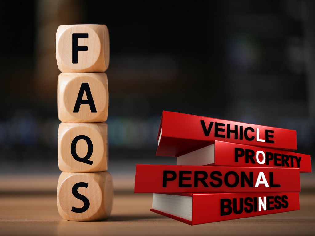 Wooden blocks spelling 'FAQ' next to stacked red books labeled with various loan types, including vehicle, property, personal, and business loans.